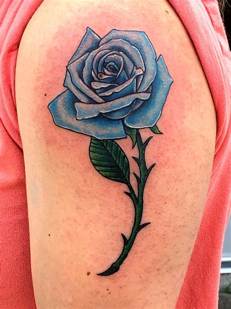 blue rose tattoo on dark skin|More.